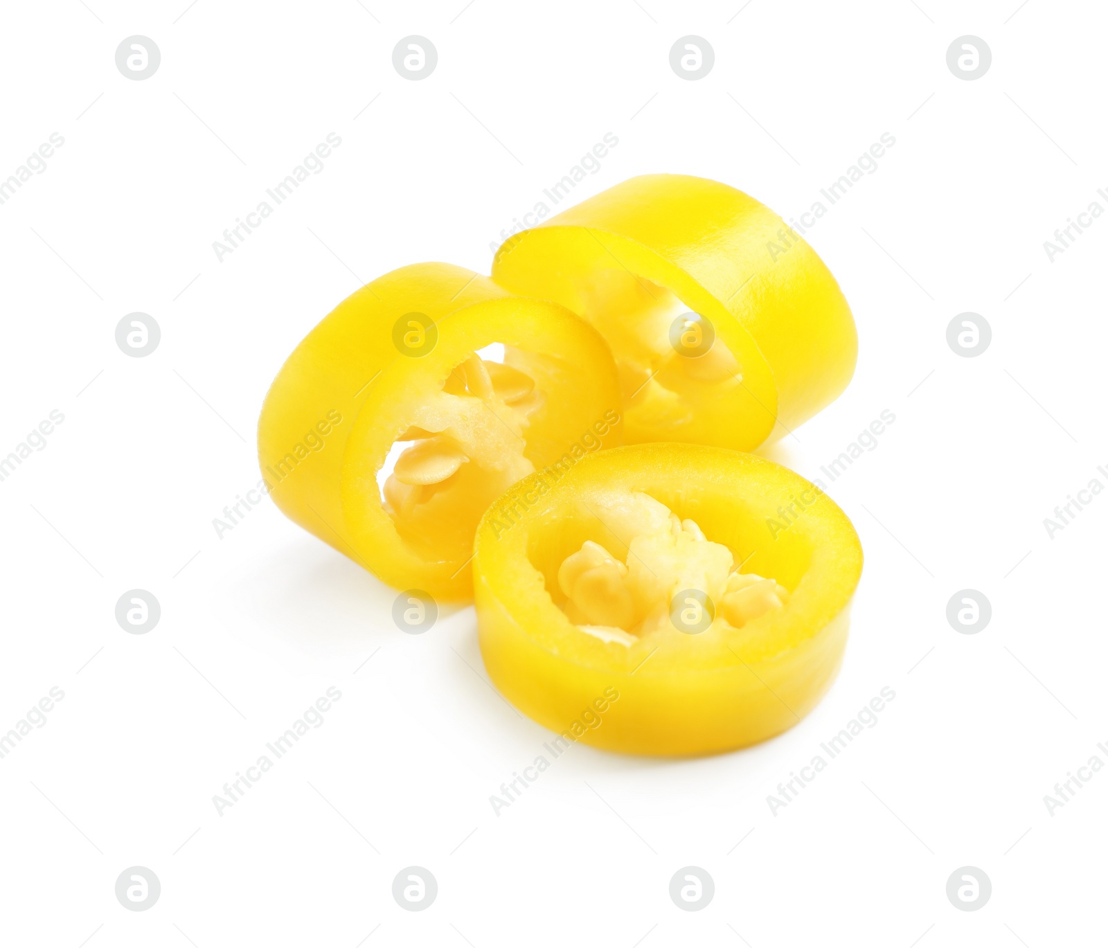 Photo of Cut ripe yellow chili pepper isolated on white