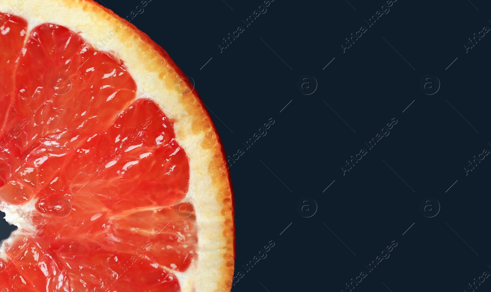 Photo of Fresh yummy orange slice on dark background