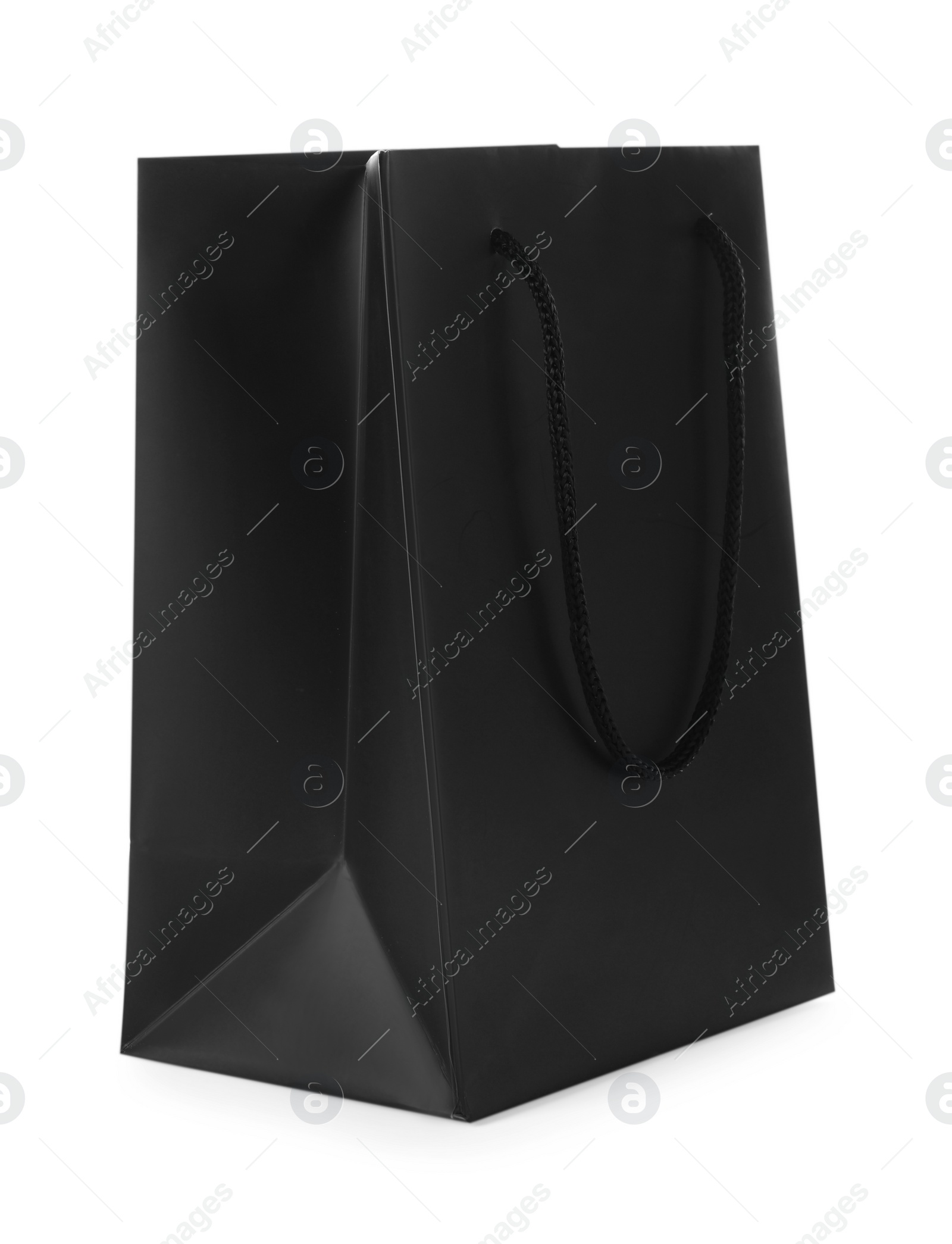 Photo of One black paper bag isolated on white