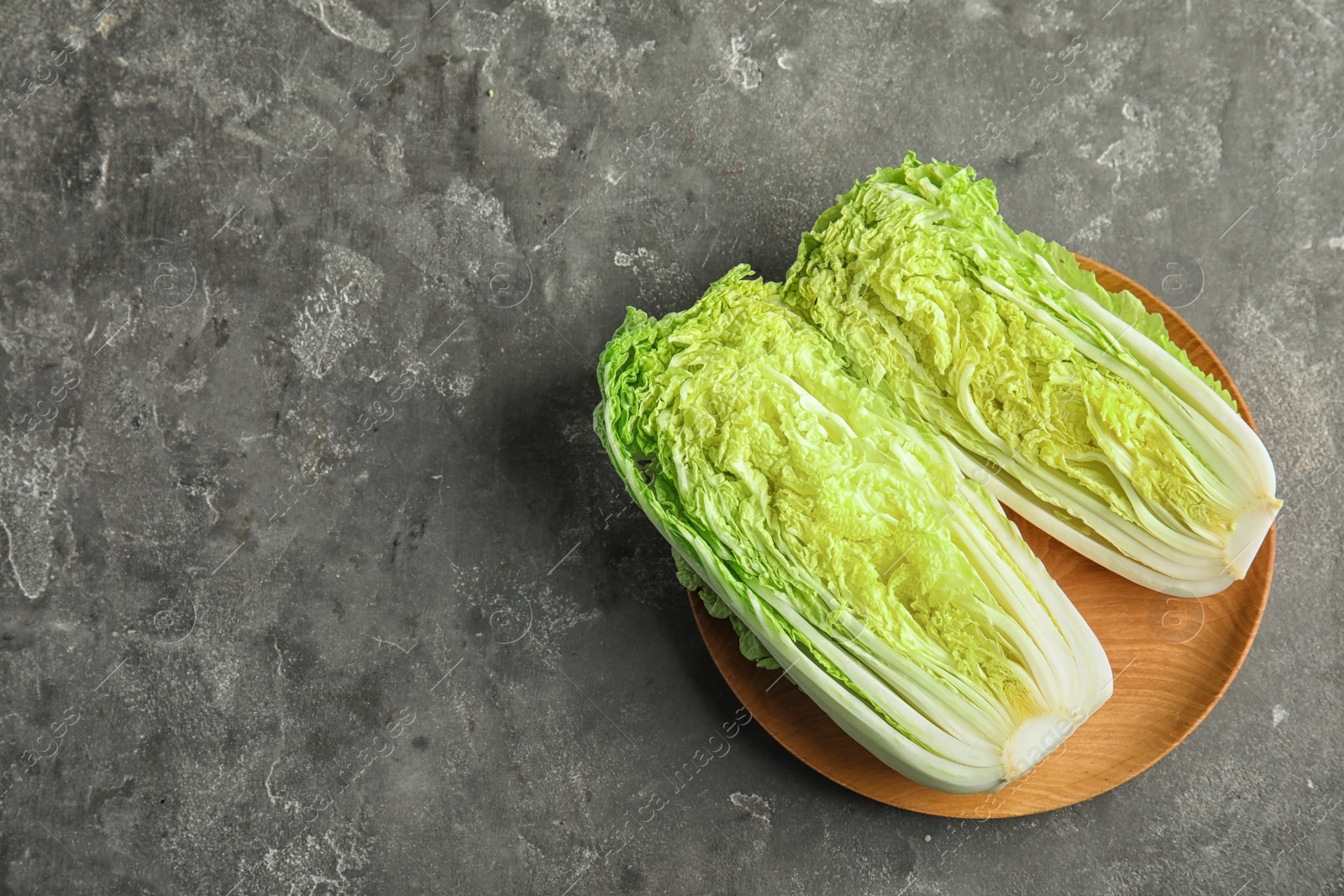 Photo of Plate with fresh sliced cabbage on table, top view