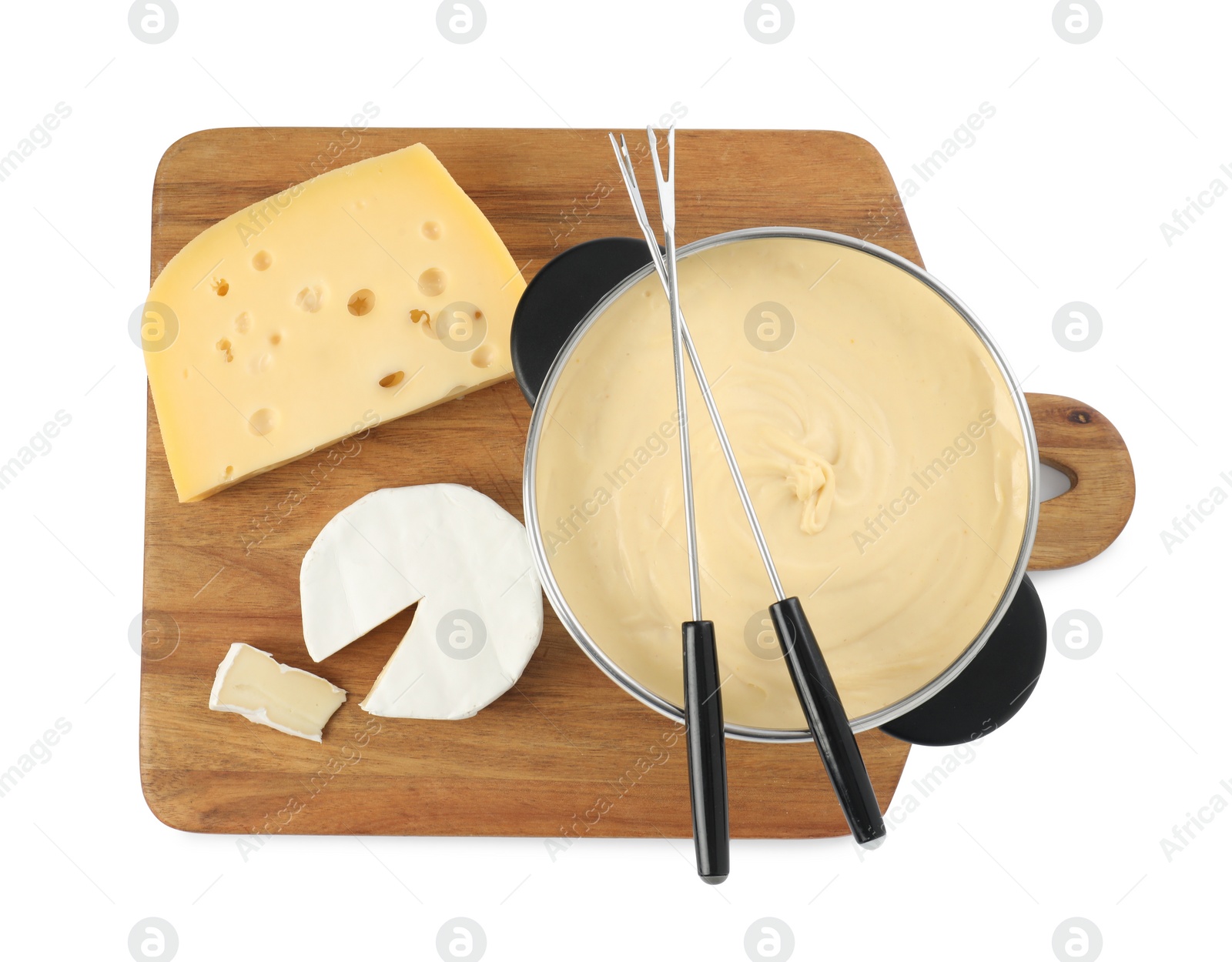 Photo of Fondue with tasty melted cheese, forks and pieces isolated on white, top view