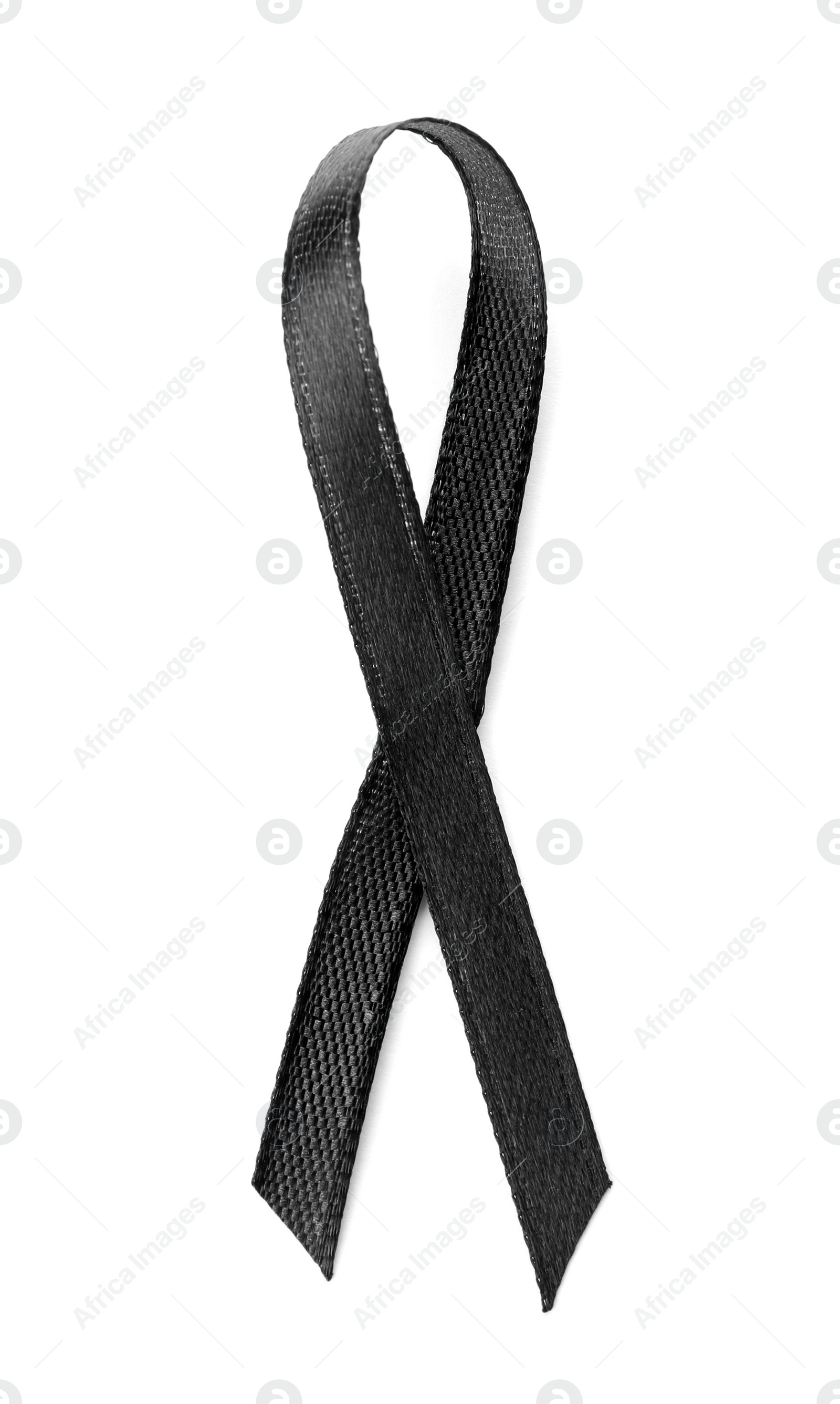 Photo of Black ribbon on white background, top view. Funeral symbol