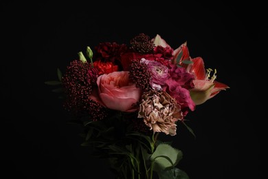 Beautiful bouquet of fresh flowers on dark background