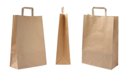 Image of Set with kraft paper bags on white background 