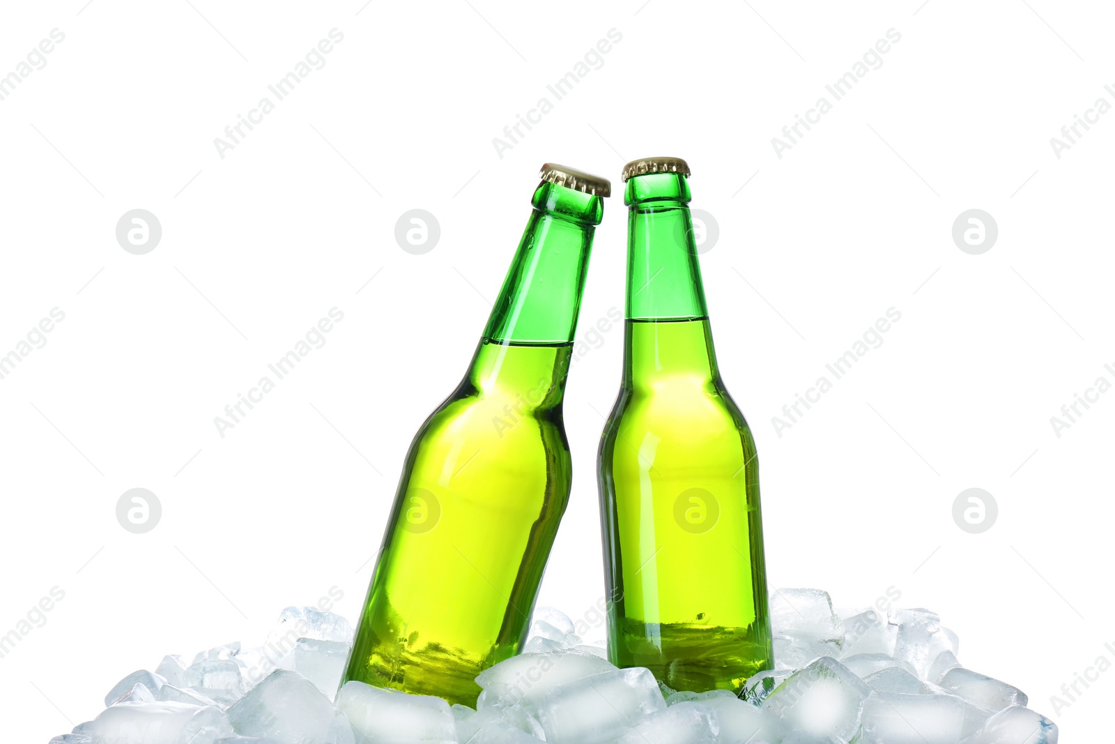 Photo of Bottles of beer on ice cubes against white background