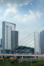 View of beautiful city from modern bridge