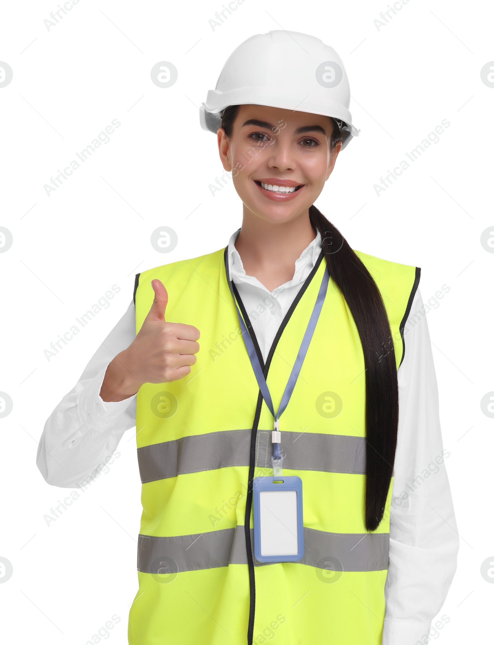 Photo of Engineer with hard hat and badge showing thumb up on white background