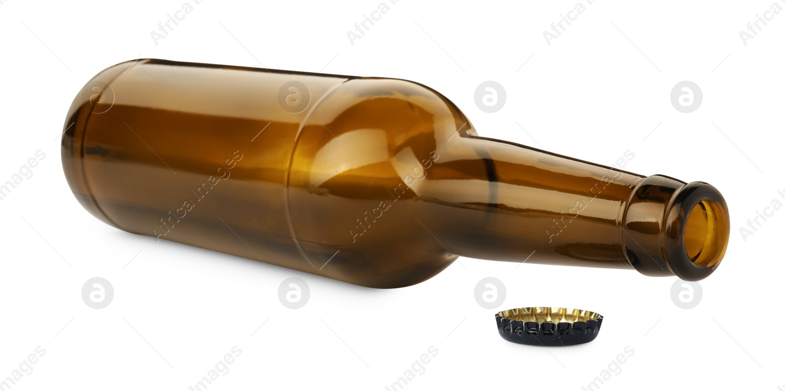 Photo of One empty brown beer bottle and cap isolated on white
