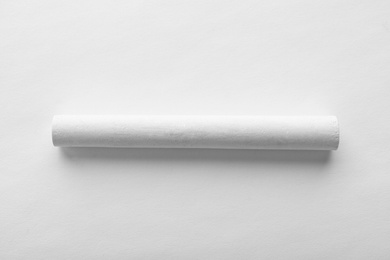 Photo of Piece of chalk isolated on white, top view