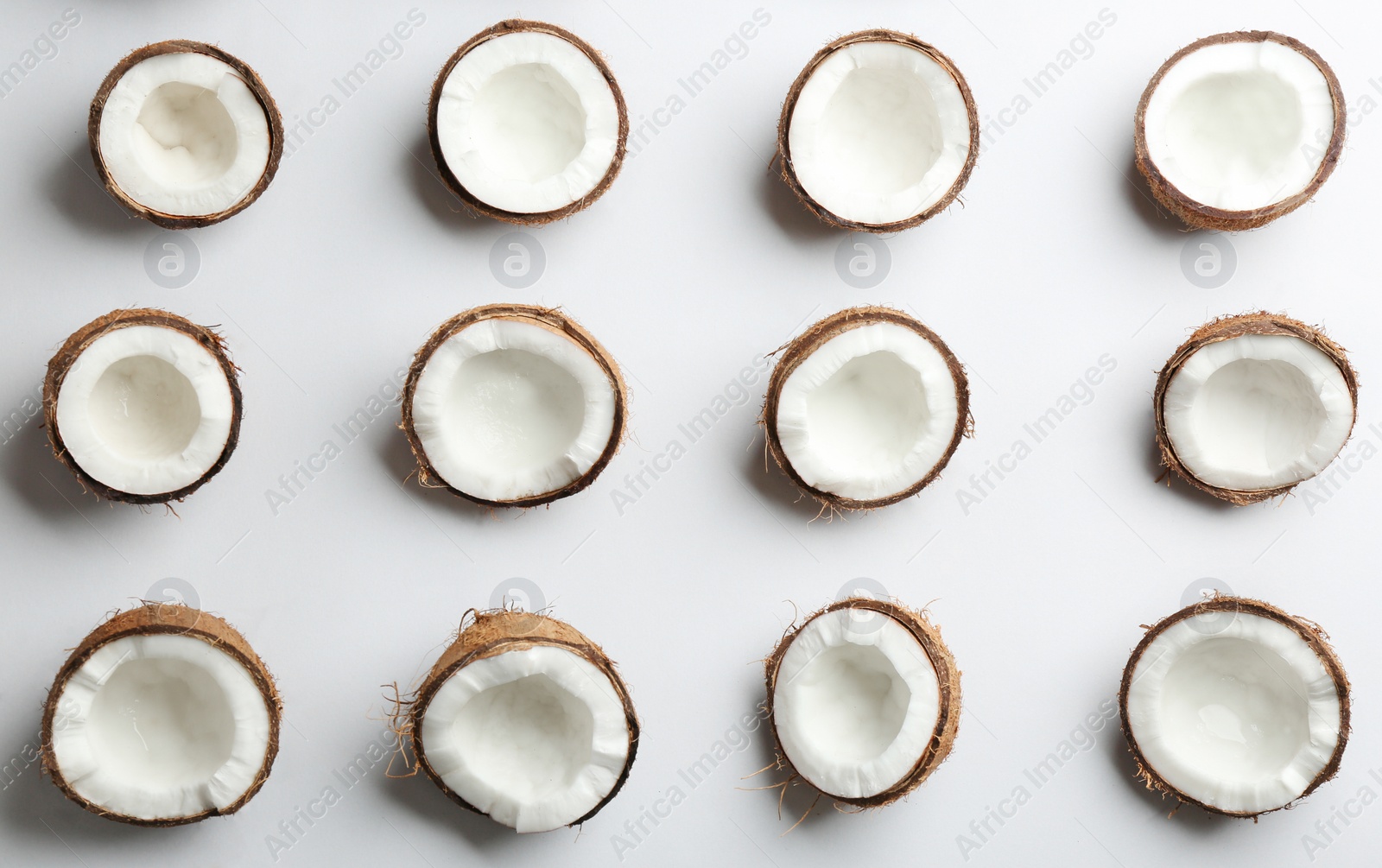 Photo of Coconut pattern on white background, top view