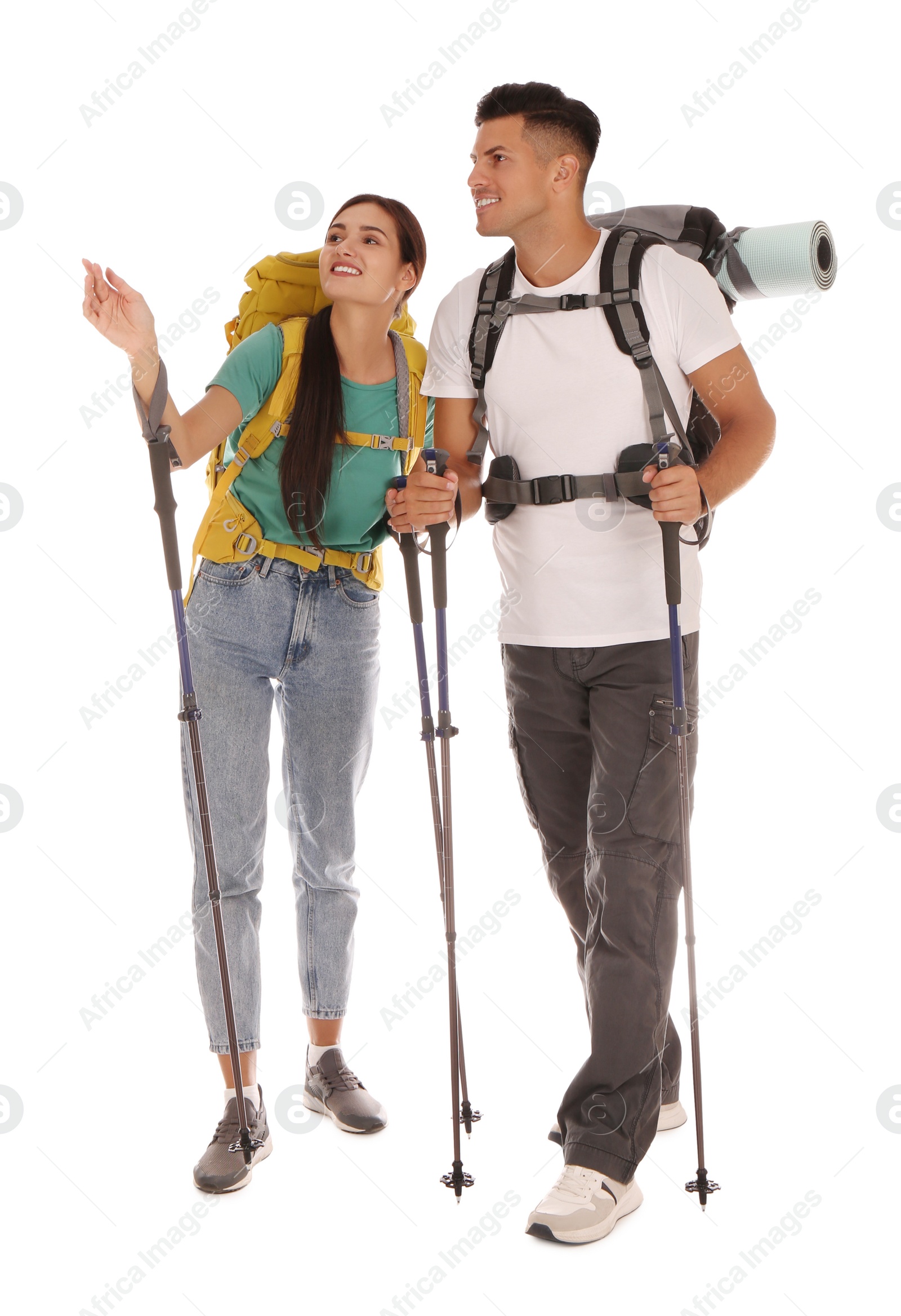 Photo of Couple of hikers with backpacks and trekking poles on white background