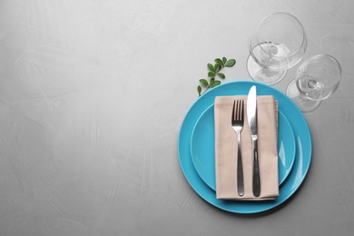 Photo of Elegant table setting on grey background, top view. Space for text