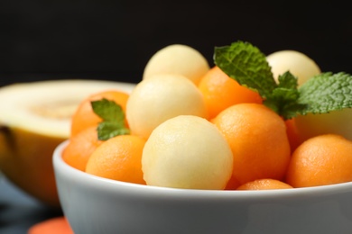 Melon balls and mint in bowl, closeup