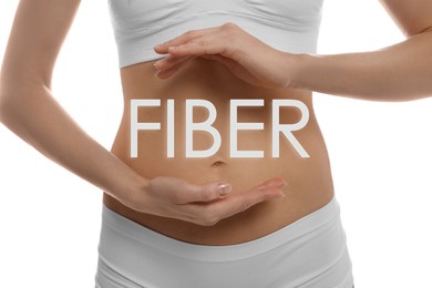 Image of Woman holding hands near belly and word Fiber, closeup