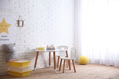 Baby room interior with toys and stylish furniture