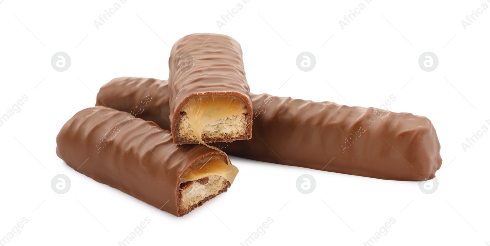 Photo of Sweet tasty chocolate bars with caramel on white background