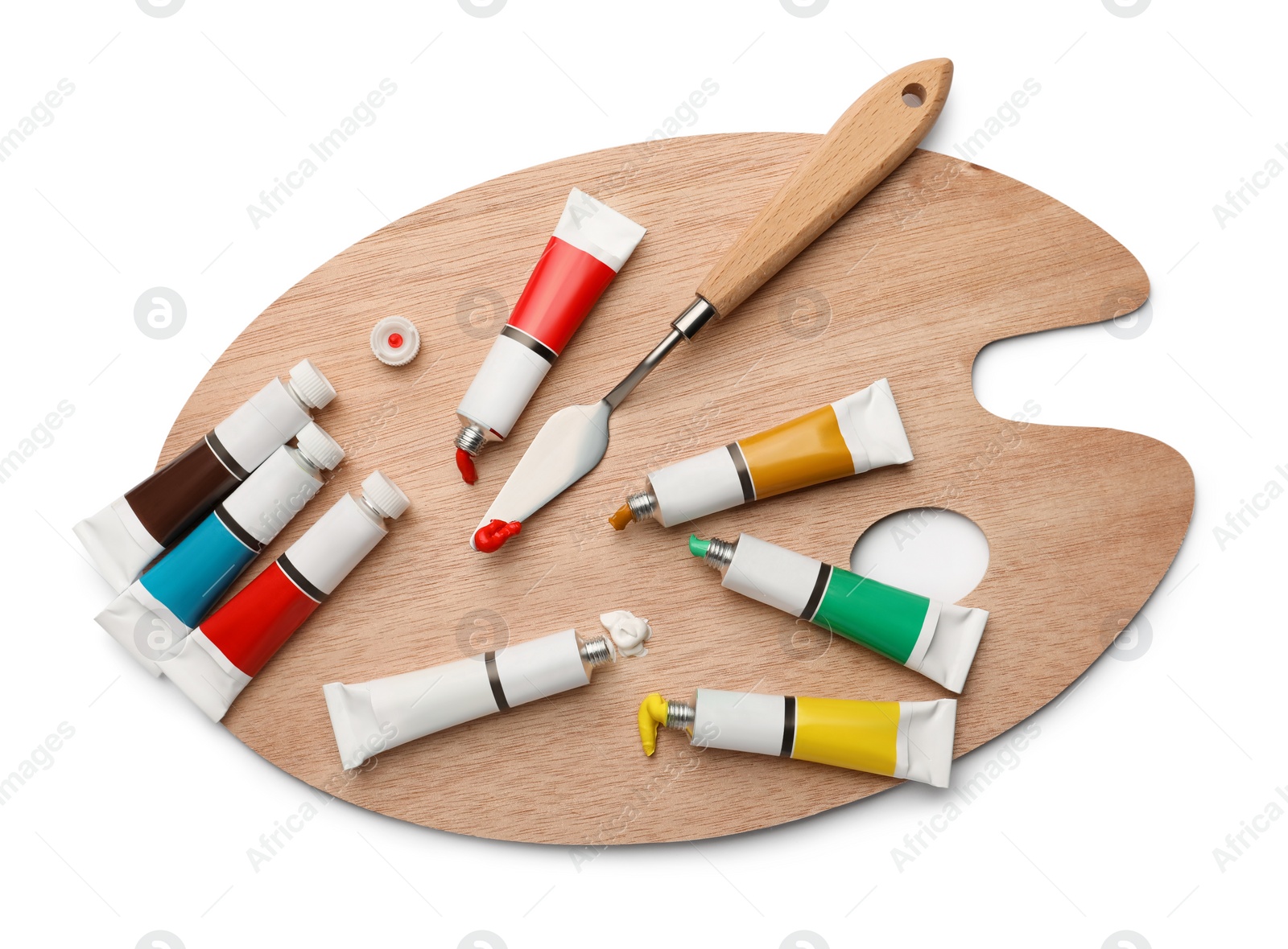 Photo of Wooden palette with oil paints and palette knife on white background, top view