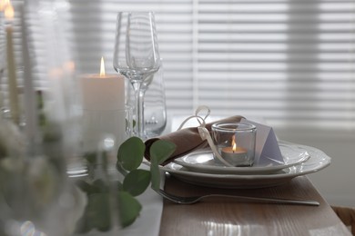 Festive table setting with beautiful tableware and decor indoors