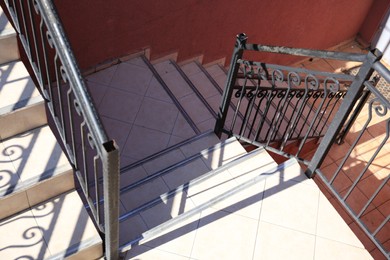 Photo of Beautiful stairs with metal handrails outdoors, above view