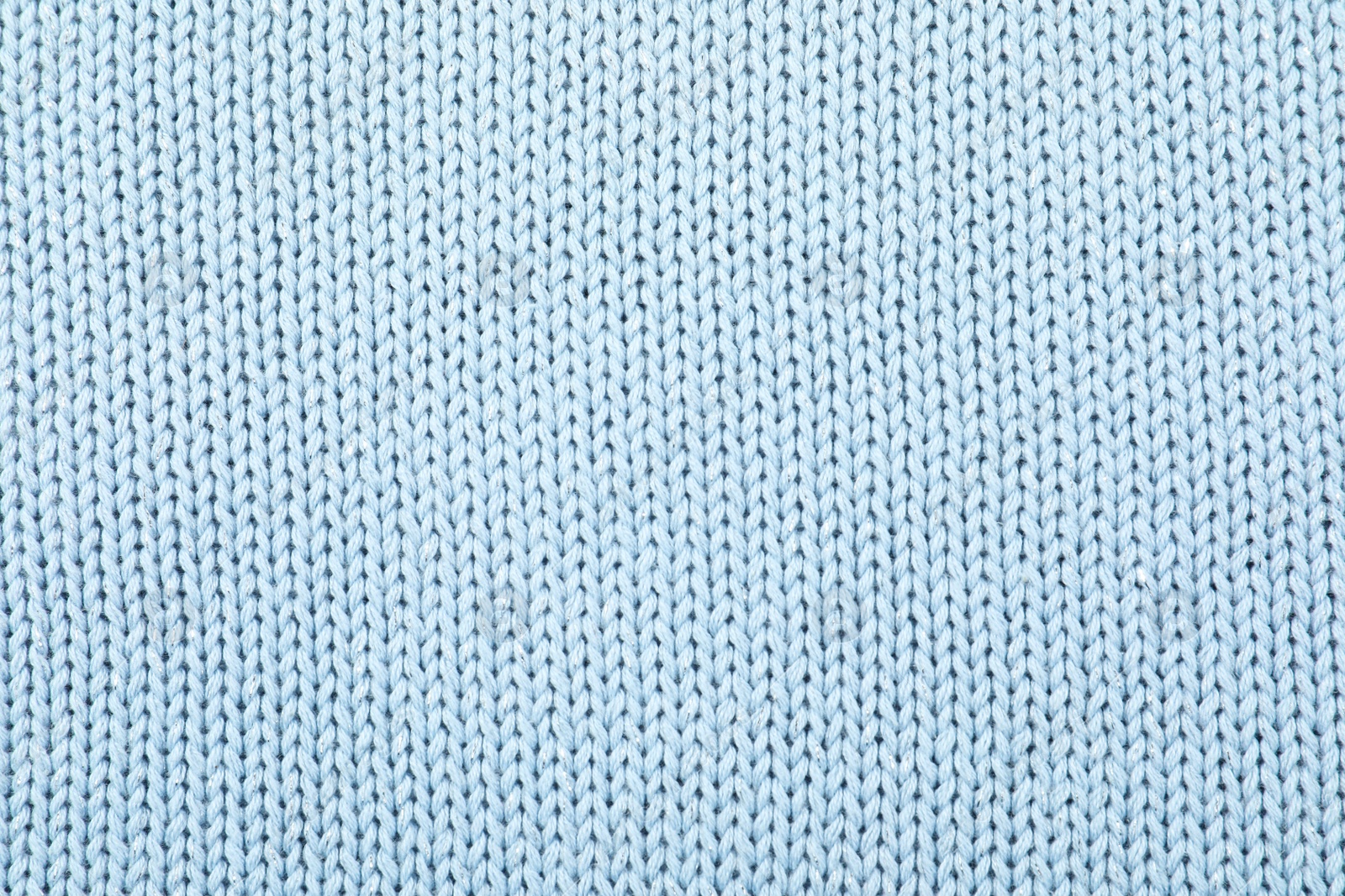 Photo of Texture of cozy warm sweater as background, closeup