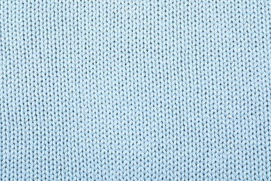 Texture of cozy warm sweater as background, closeup