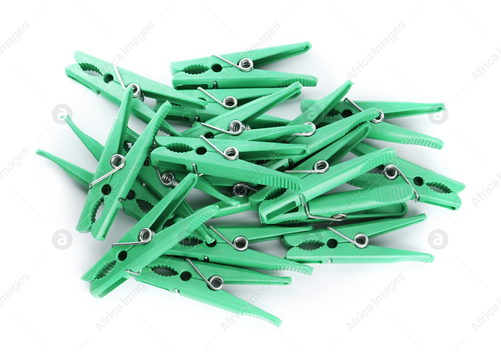 Photo of Green plastic clothespins on white background, top view