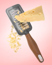 Image of Grating cheese with hand grater on pink background