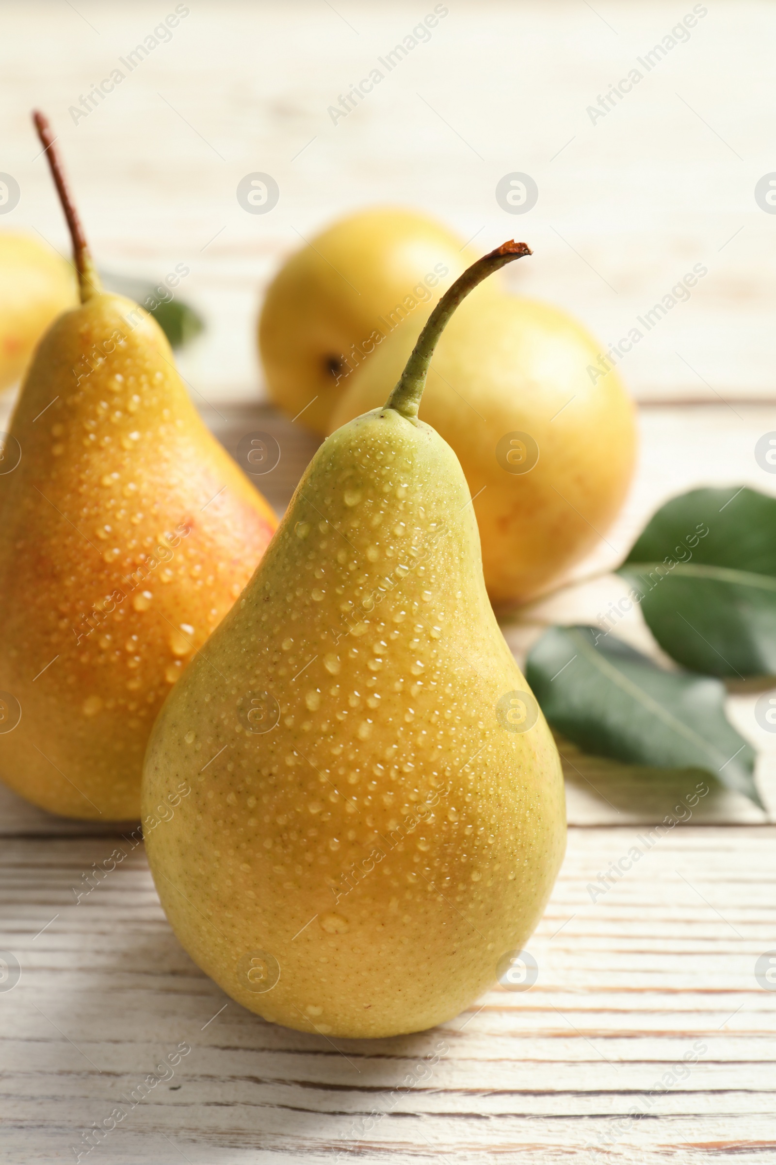 Photo of Ripe pears on wooden table. Healthy snack