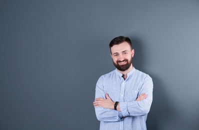 Portrait of handsome bearded man on color background