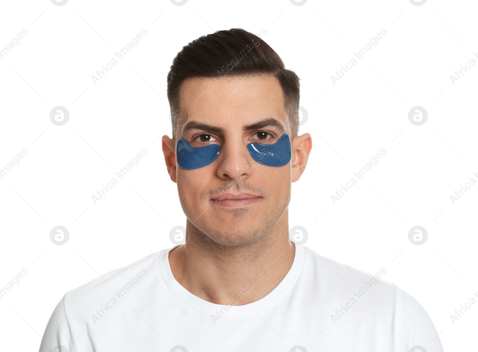 Photo of Man with blue under eye patches on white background