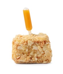 Photo of Piece of Napoleon cake with jam pipette on white background