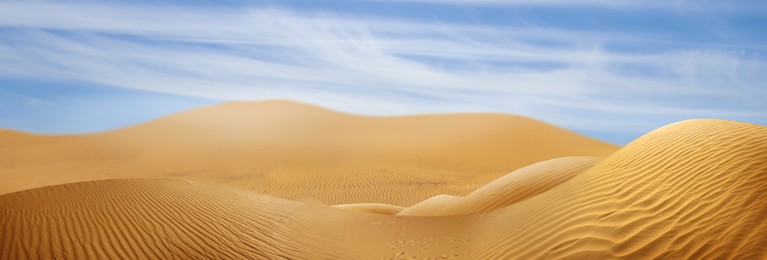 Image of Picturesque view of sandy desert and blue sky on hot sunny day. Banner design