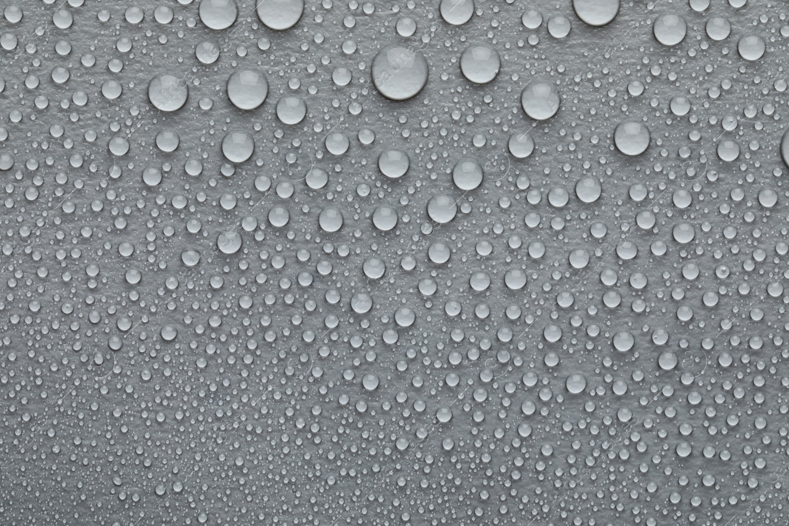 Photo of Water drops on grey background, top view