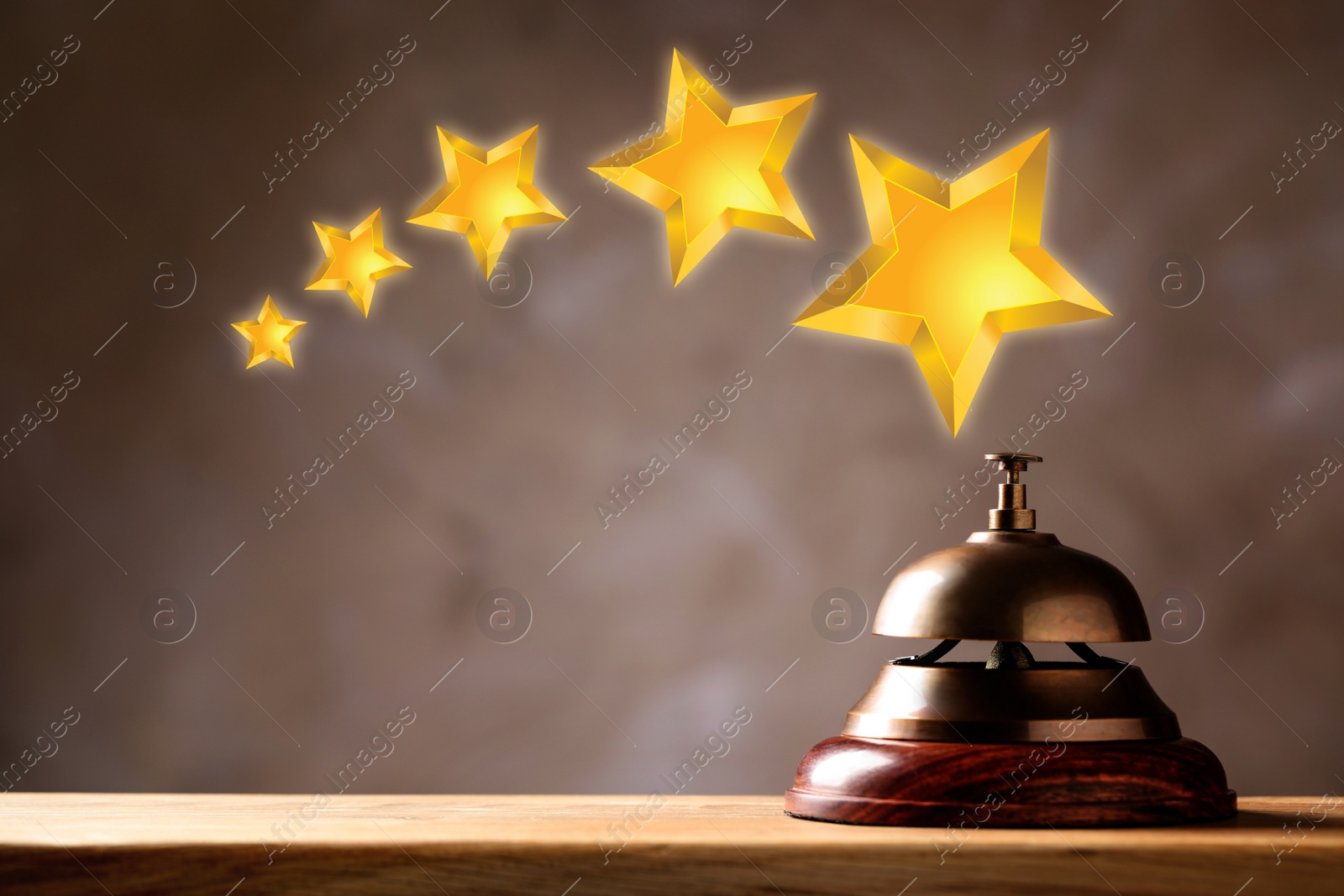 Image of Five Star Luxury Hotel. Service bell on wooden table