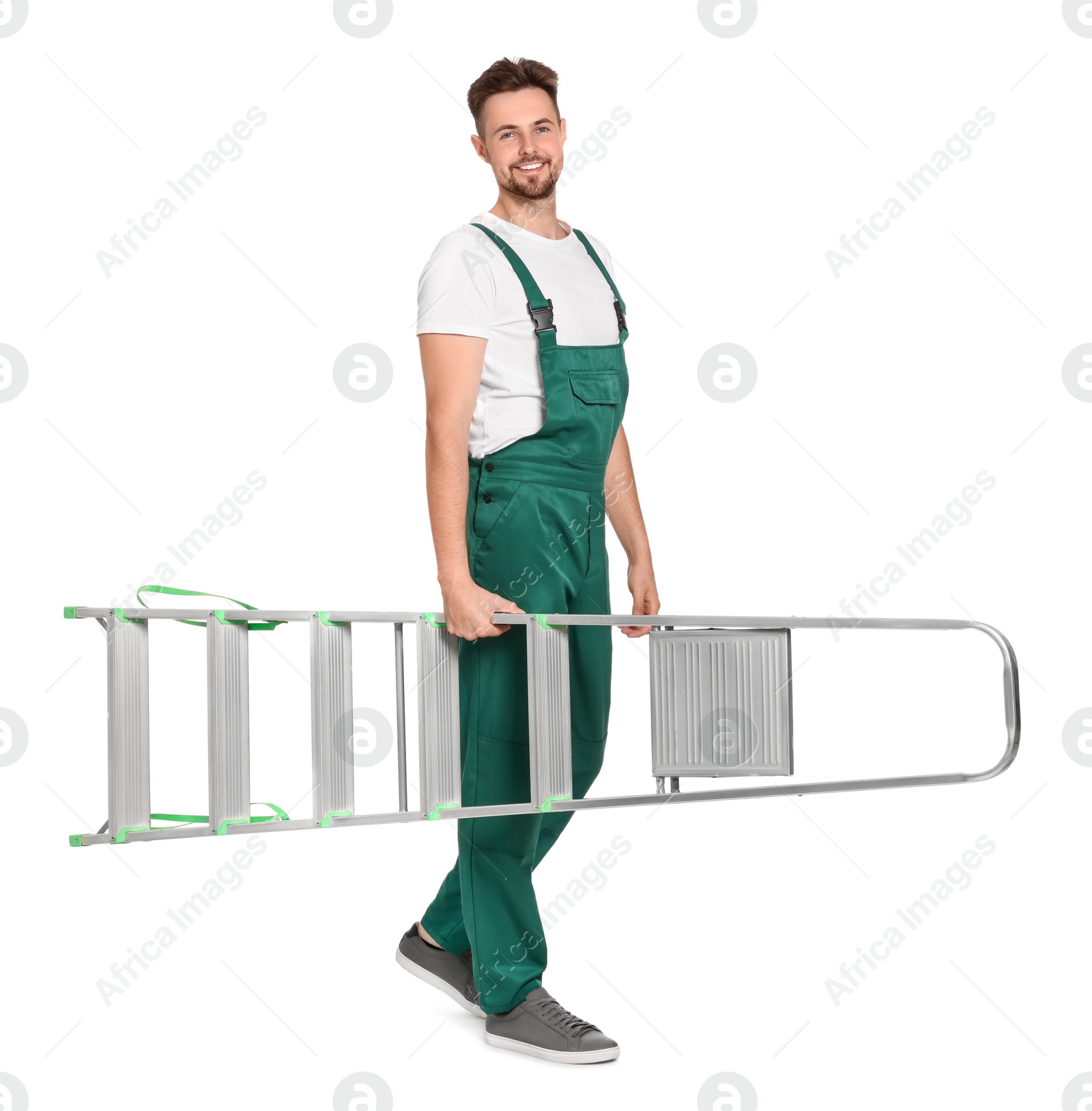 Photo of Worker in uniform holding metal ladder on white background