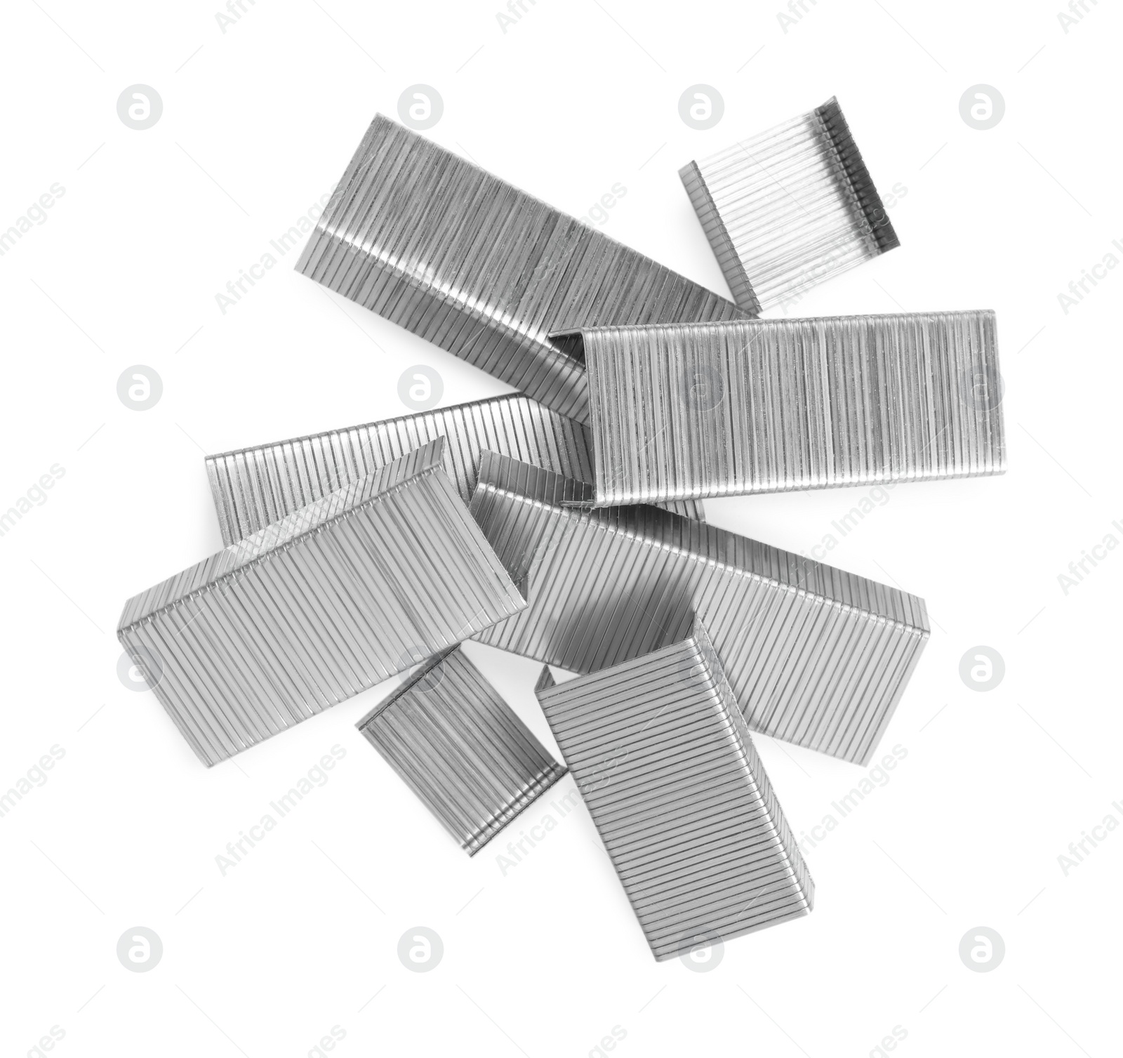 Photo of Many staple gun refills isolated on white, top view