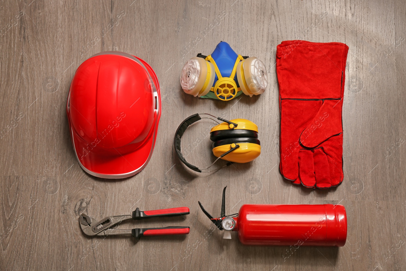 Photo of Flat lay composition with safety equipment on wooden background