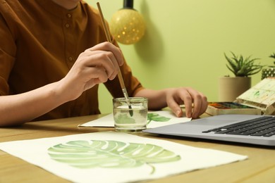 Photo of Woman drawing picture at online art lesson, closeup. Distant learning