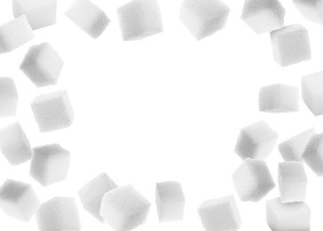 Image of Refined sugar cubes in air on white background