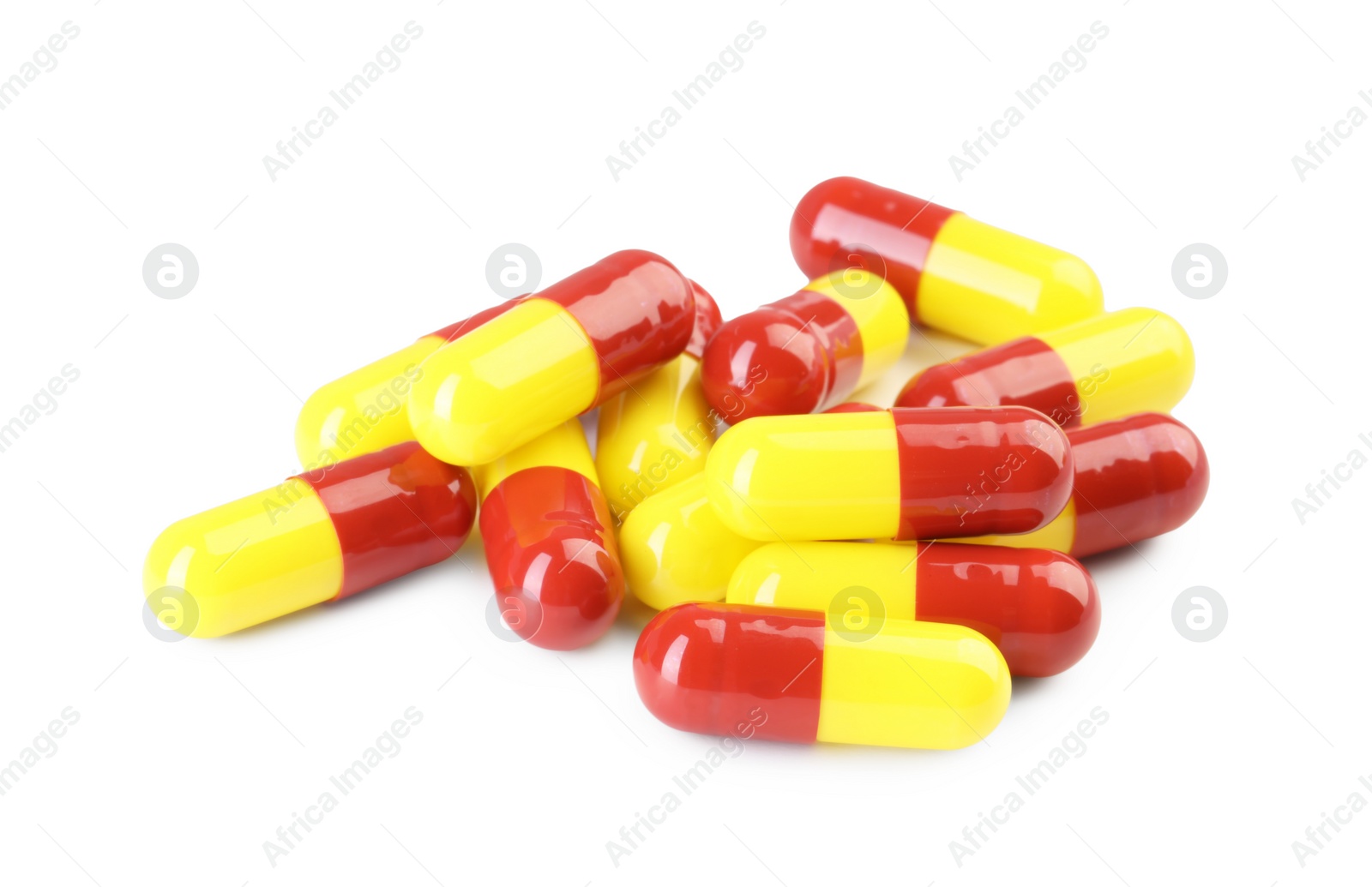 Photo of Many antibiotic pills isolated on white. Medicinal treatment