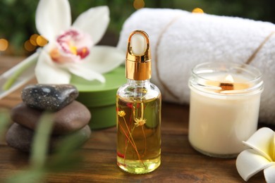 Photo of Composition with spa cosmetic on wooden table, closeup