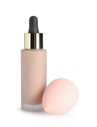 Photo of Bottle of skin foundation and sponge on white background. Makeup product