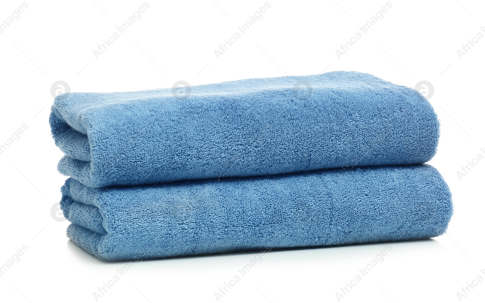 Photo of Clean color folded towels on white background