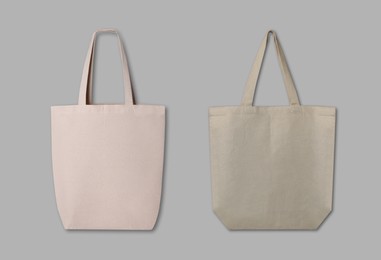 Textile eco bags on light grey background, collage. Mock up for design