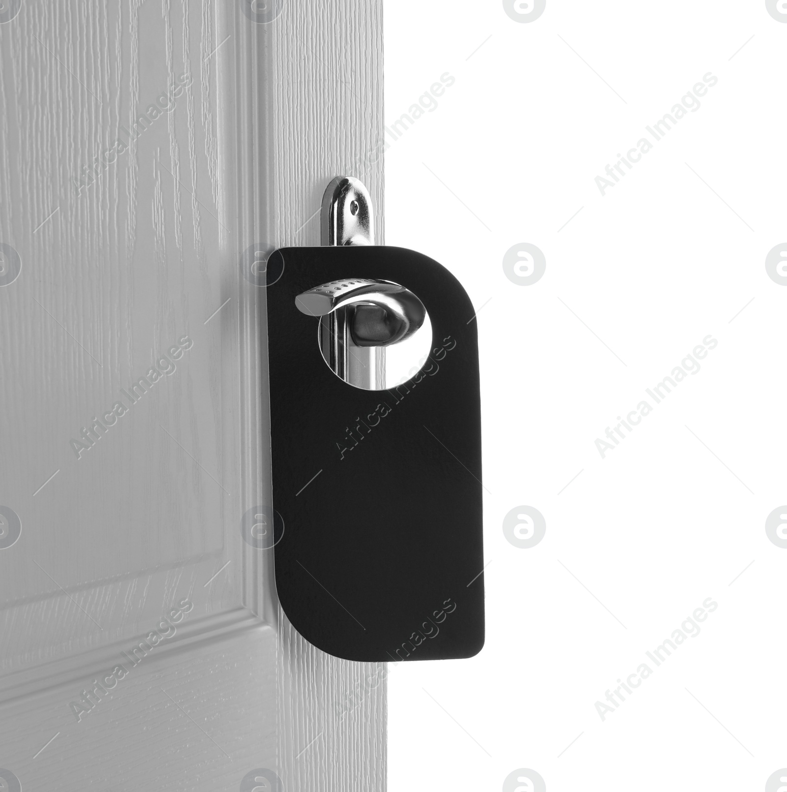 Photo of Hotel wooden door with blank hanger on white background, closeup