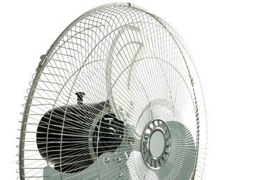 Photo of Electric fan on white background, closeup. Summer heat