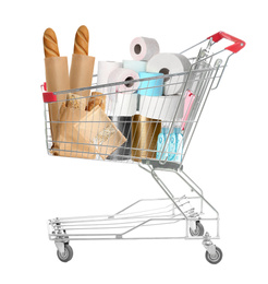 Image of Shopping cart with different products and toilet paper isolated on white 
