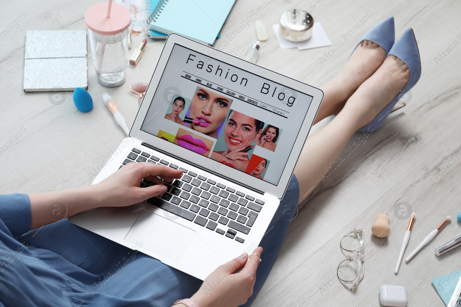 Photo of Fashion blogger with laptop on floor, closeup