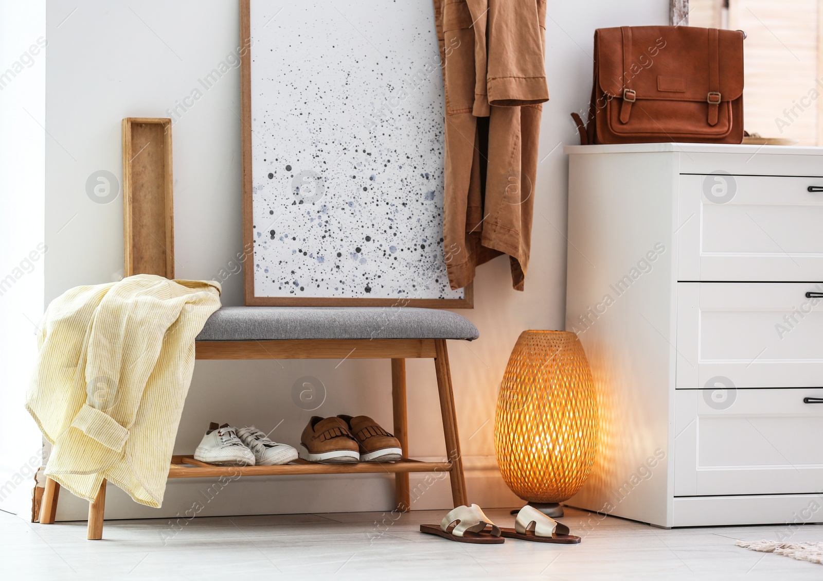 Photo of Modern hallway interior with shoe storage bench and chest of drawers