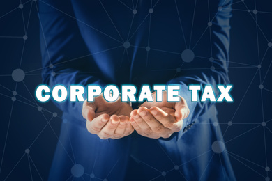 Image of Corporate tax concept. Man on color background, closeup
